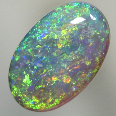 SOLID SEMI BLACK OPAL Sparkling green in a 3 dimensional pattern over blue